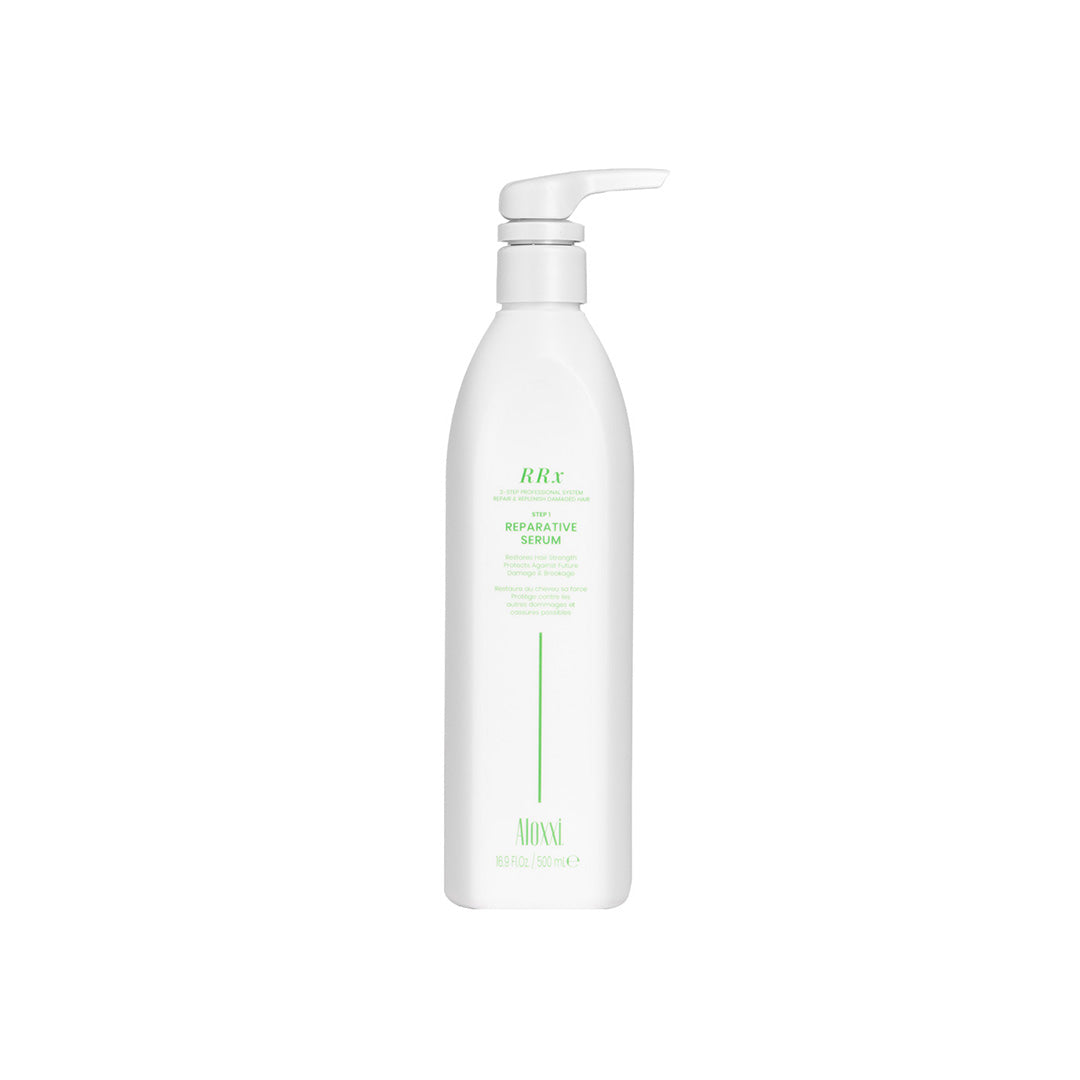 White bottle with pump of a skincare serum on a white background